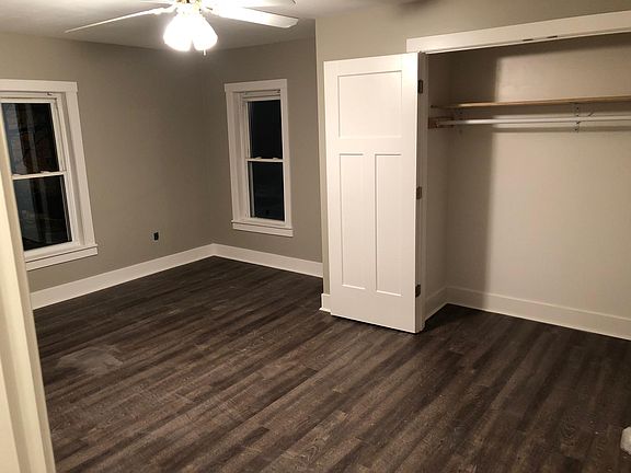 One view of largest bedroom, also leads to attic space.