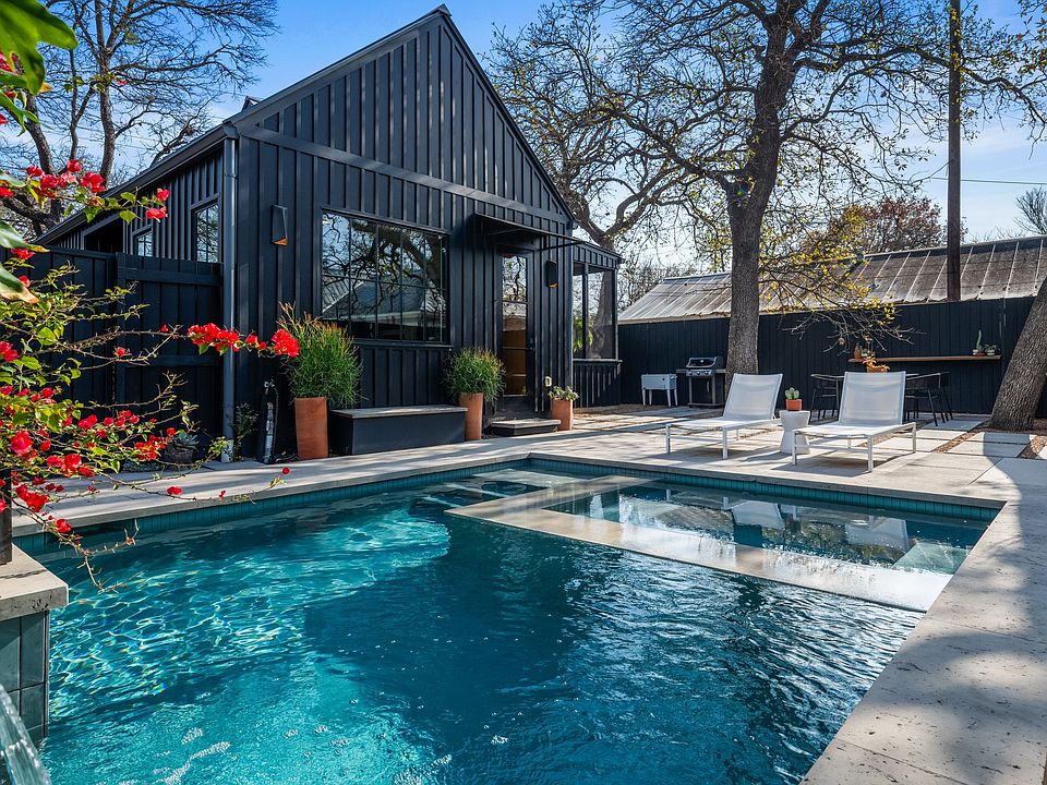 Enjoy a backyard oasis with pool and hot tub!