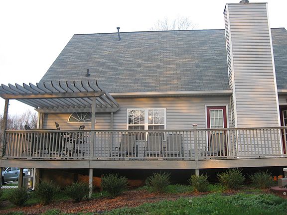 Deck across entire length of house, has pergola, electricity & cable hook up