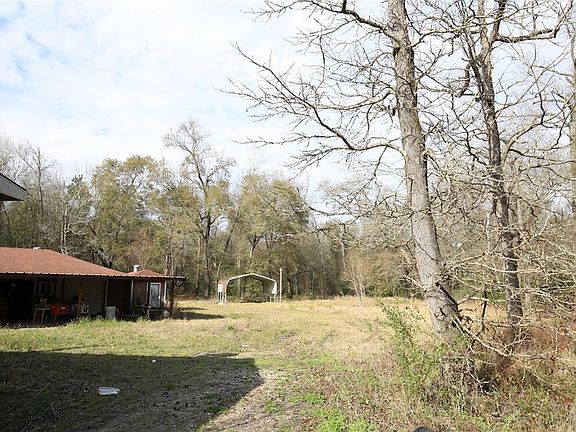 LARGE GARAGE/WORKSHOP BEHIND MOBILE. 3.4 ACRES FOR OTHER BUILDINGS OR MOBILE HOMES