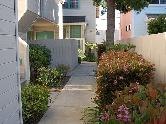 Walking through property to stairs and entry.