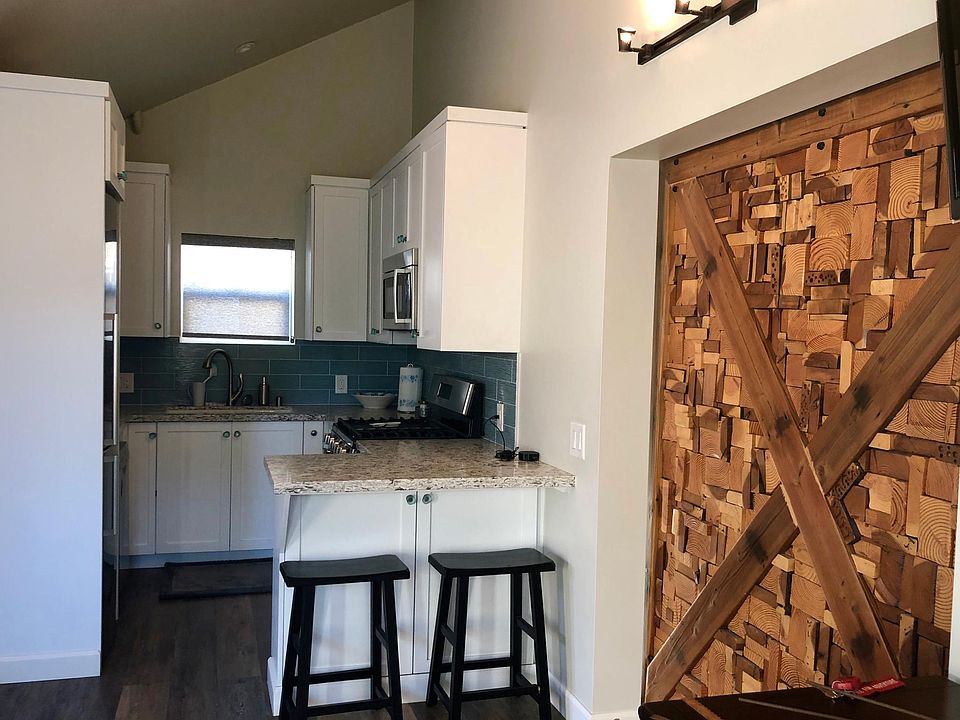Kitchen includes dishwasher and microwave.
