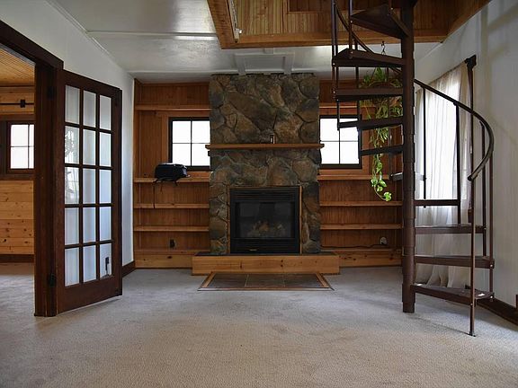 Gas Fireplace. Spiral stairs to loft