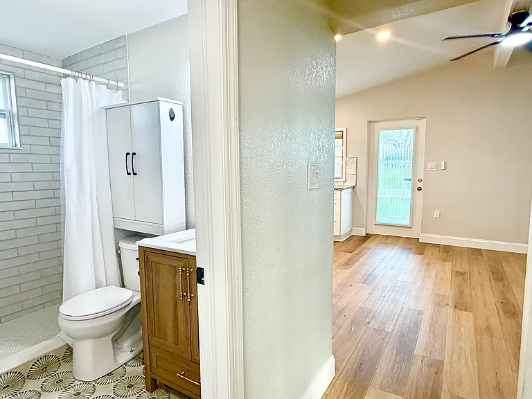 Bath in relation to kitchen and living room