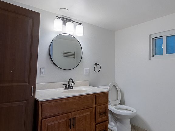 Spacious bathroom with large vanity and linen storage