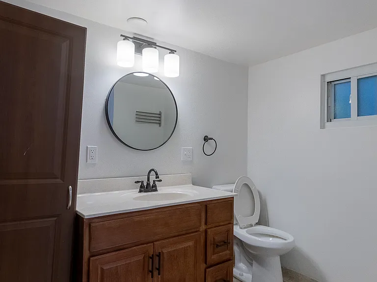 Spacious bathroom with large vanity and linen storage