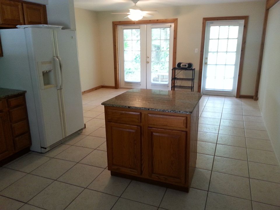 Kitchen with island and living room