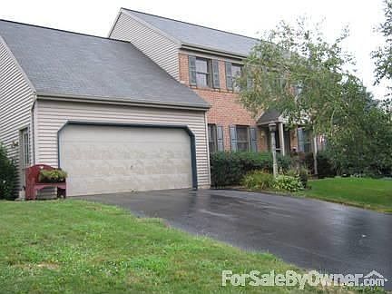 Front of House : Beautiful colonial two-story. Garage door opener with keyless entry pad.