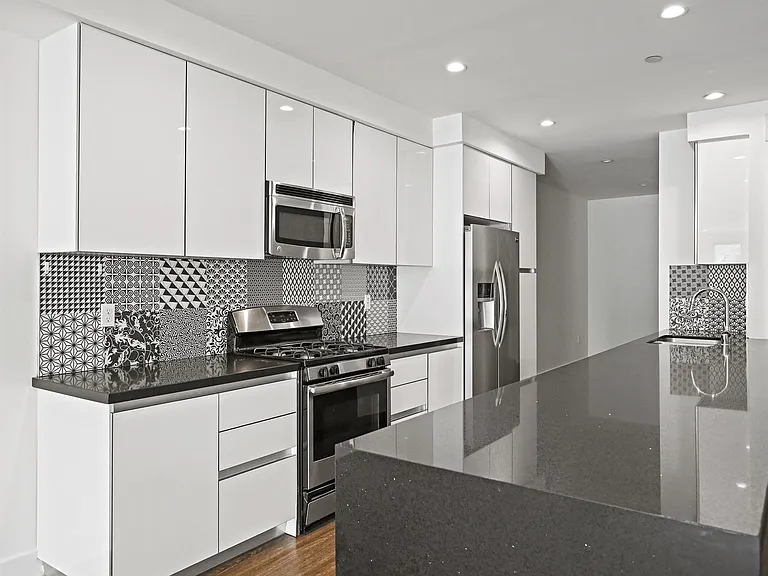 Kitchen with Stainless Steel Appliances and Ample Cabinet Storage