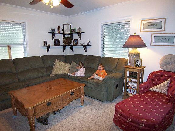 White blinds in all windows. Bahama shutters for storm and sun protection.