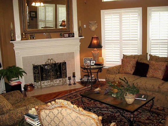  DEN WITH PLANTATION SHUTTERS AND BUILT INS, WOOD FLOORS