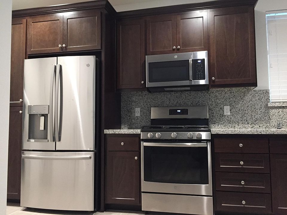 Full kitchen with refrigerator, microwave, oven, dish washer.