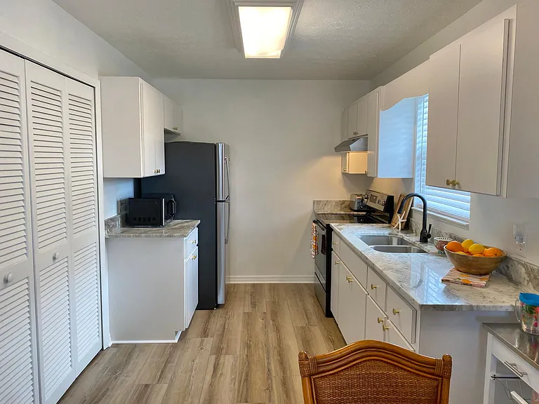 Kitchen - with granite countertops and stainless steel appliances
