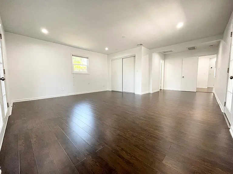 Main bedroom with en-suite bathroom to the far left. Also private patio area with access directly to the backyard.