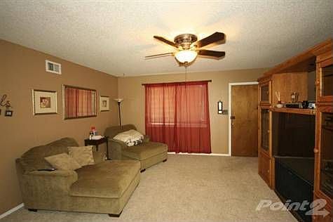 Living room from the dining, newer carpet, neutral paint