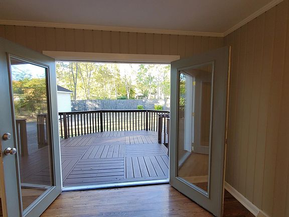 Door from living room leading to large deck
