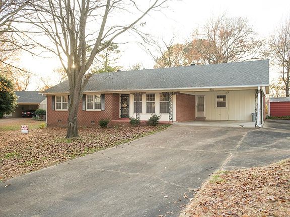 Front of Home with 2 car Carport and side drive