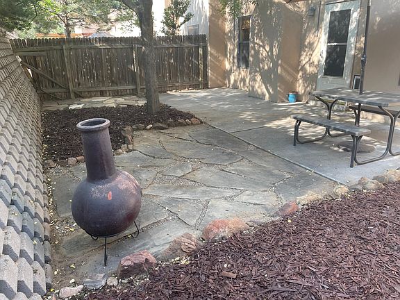 Private rear outdoor space with patios accessible from living area