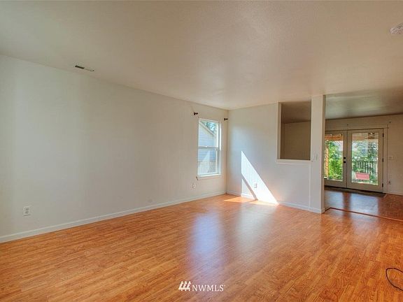 As you enter, you'll be greeted with the spacious family room. 