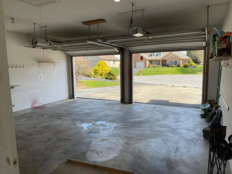 Two car garage with garage door openers, and remote opener