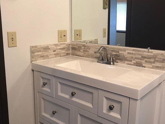 Bathroom with new vanity and custom marble tile