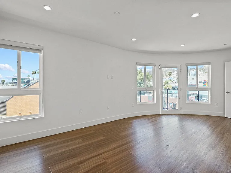 Large-Size Living Room with Recessed Lighting, Vinyl Flooring, and Patio