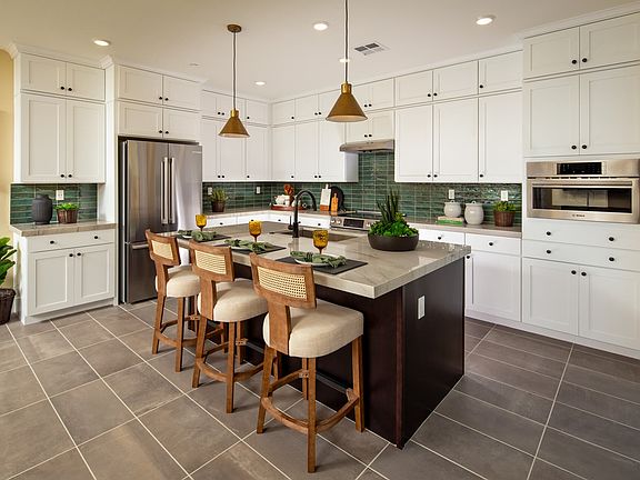 This modern kitchen is a sleek and functional culinary space that combines cutting-edge design with