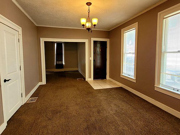Dining Area with main floor Bedroom on the left and Living Room in the front of the Home.