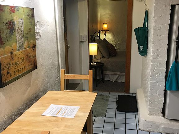 Kitchen table and view into bedroom