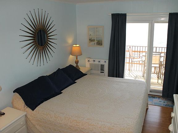 Master bedroom with king bed, view and balcony.