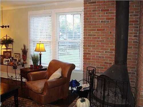Living area with woodburning fireplace