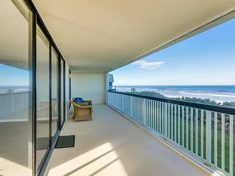 80' wrap around balcony, SE corner view; furniture is provided although mostly missing from this pic