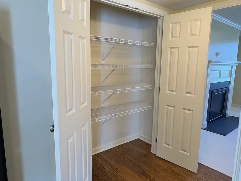 Substantial pantry space between kitchen and living room.