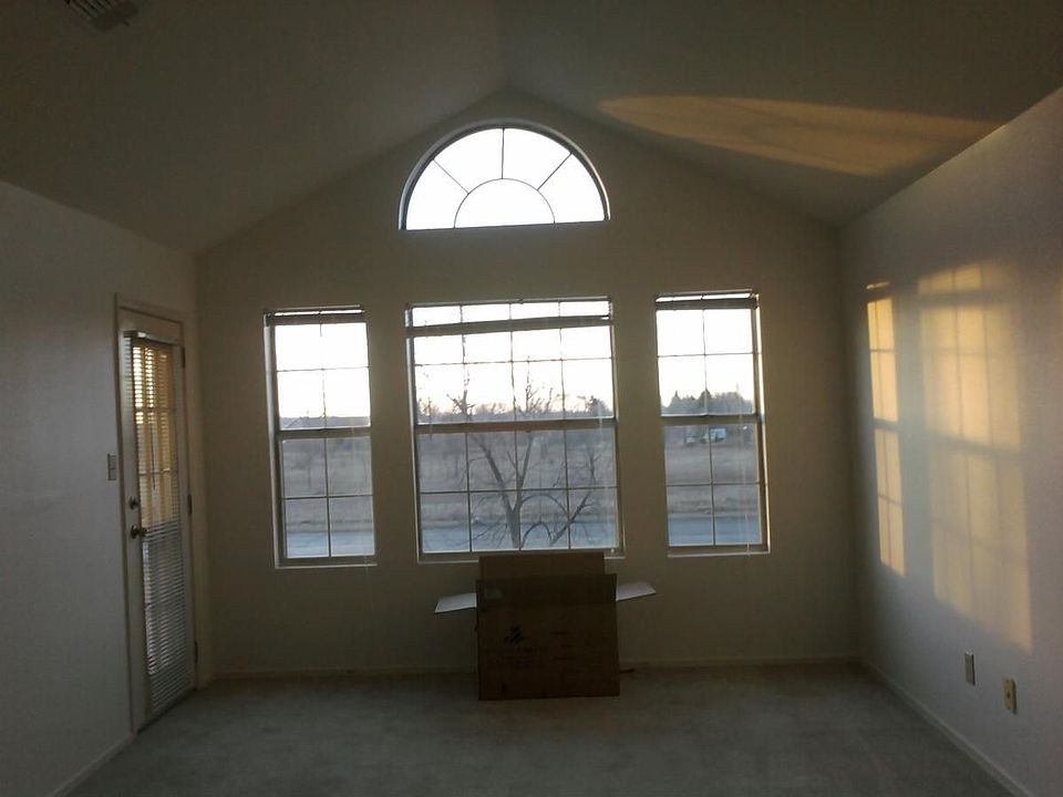 Living Room with Cathedral Ceiling and Scenic View