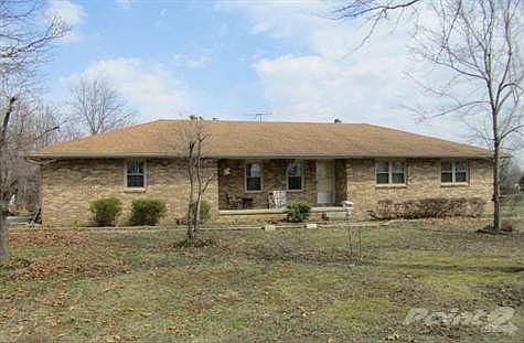 Front view of this all brick exterior home resting on a quiet 3.10 acres.