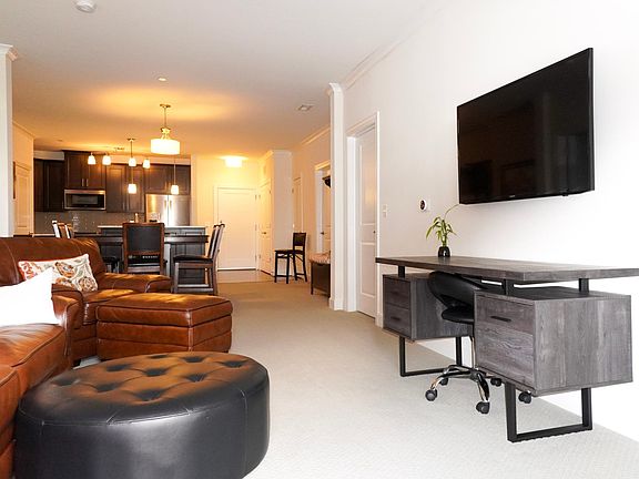 Open concept living, dining and kitchen. Entertainment center and furniture included to rent.