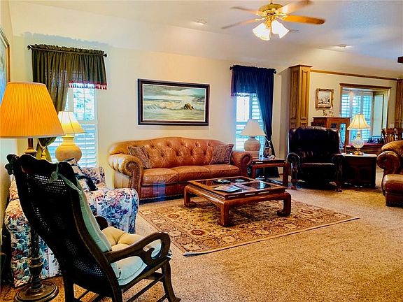 Main living area with true plantations shutters.  The shutters are throughout the entire home.