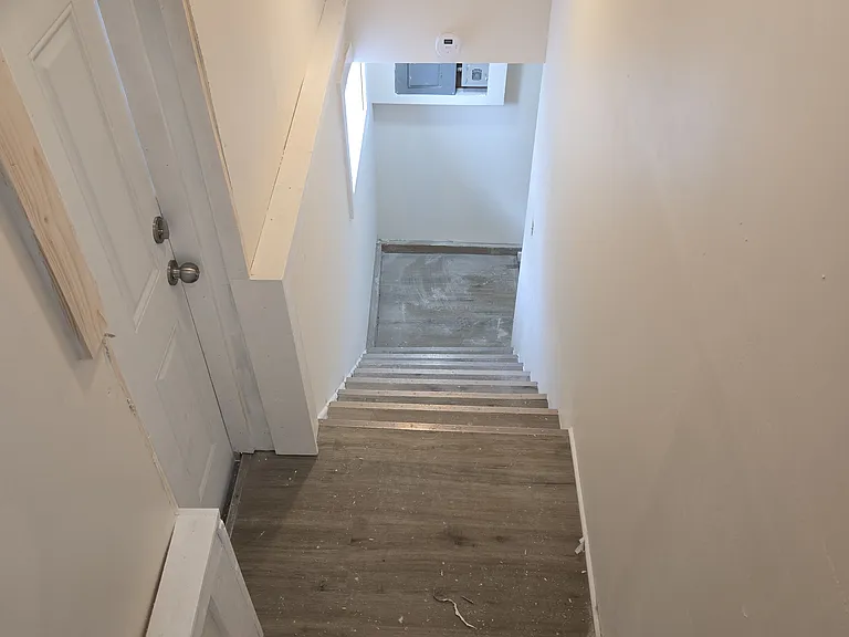 Staircase to basement with exit to outside