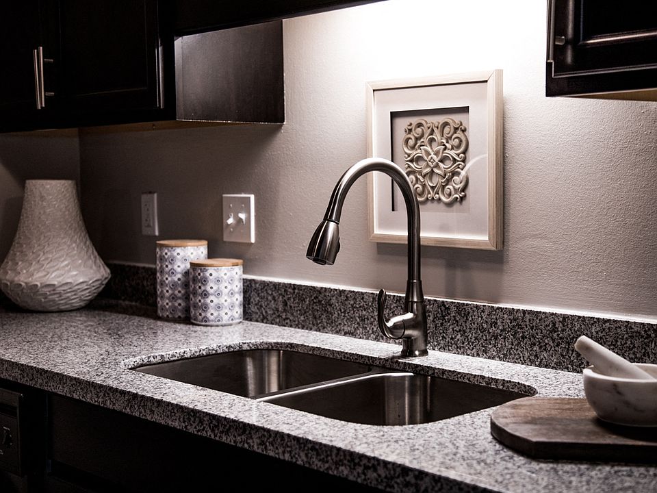 Updated Kitchen with Granite Countertops and Stainless-Steel Sink