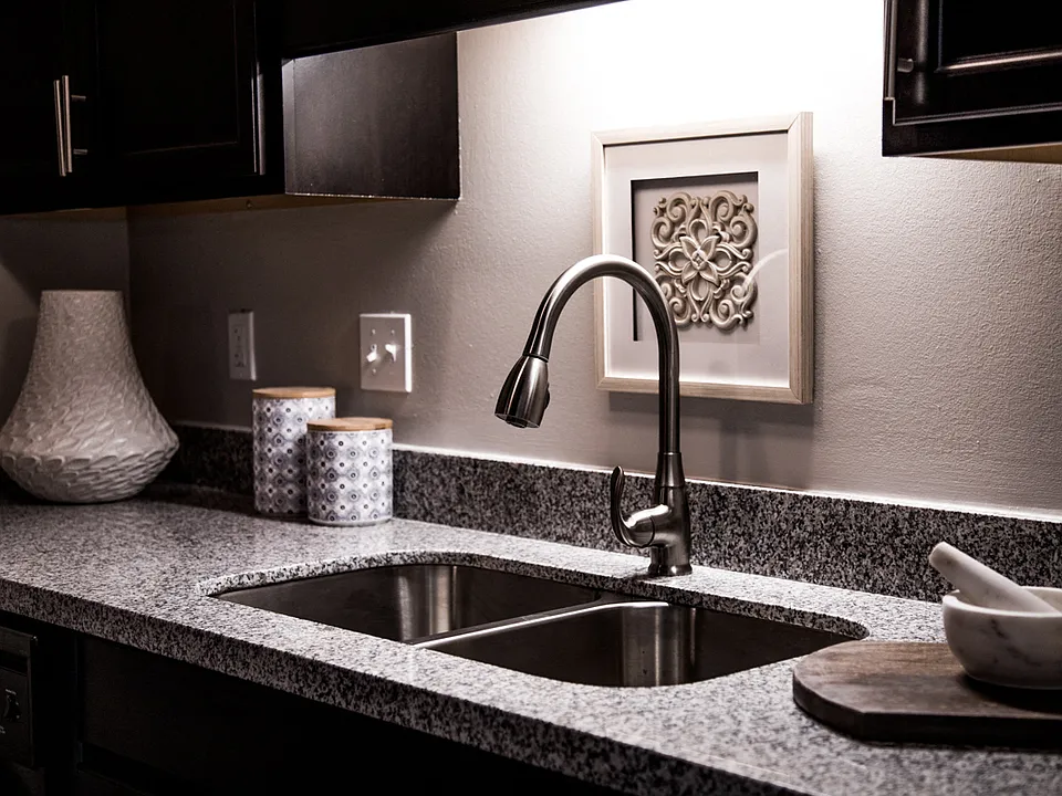 Updated Kitchen with Granite Countertops and Stainless-Steel Sink