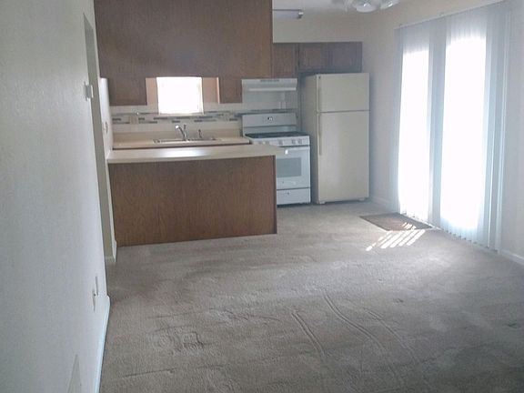 VIEW FROM ENTRANCE. THIS IS THE LIVING ROOM KITCHEN AREA.