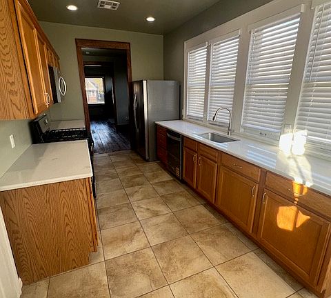 Kitchen all mew appliances and quartz counter top facing north