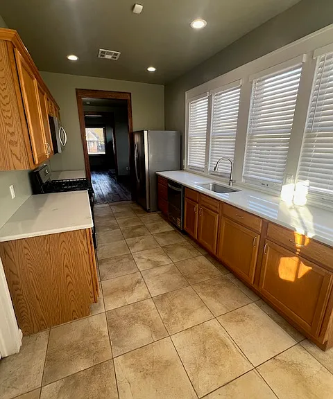 Kitchen all mew appliances and quartz counter top facing north