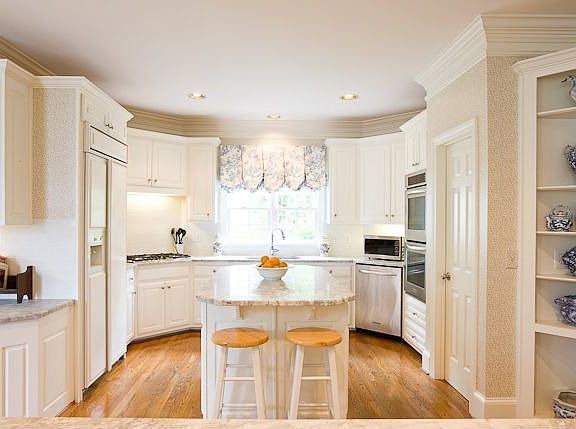 Recently updated, the open kitchen has EnergyStar stainless appliances, gorgeous granite counters, a