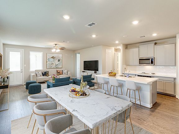 Open concept living room, dining room and kitchen perfect for entertaining