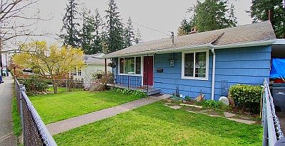 Nice curb appeal with this old charmer. Chain link fencing encloses the entire property and the fron