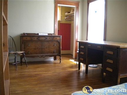 Master bedroom with hard wood floors.