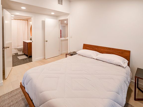 Primary bedroom & adjoining full bath with tub