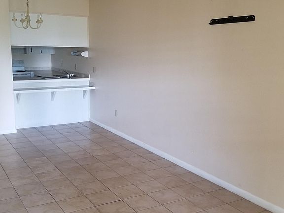 LIVING ROOM VIEW TO DINING & KITCHEN