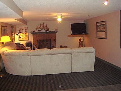 Family room with wood burning fire place.